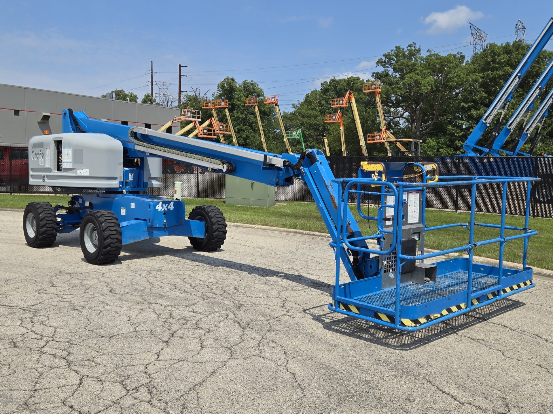 Boom lift working at industrial site